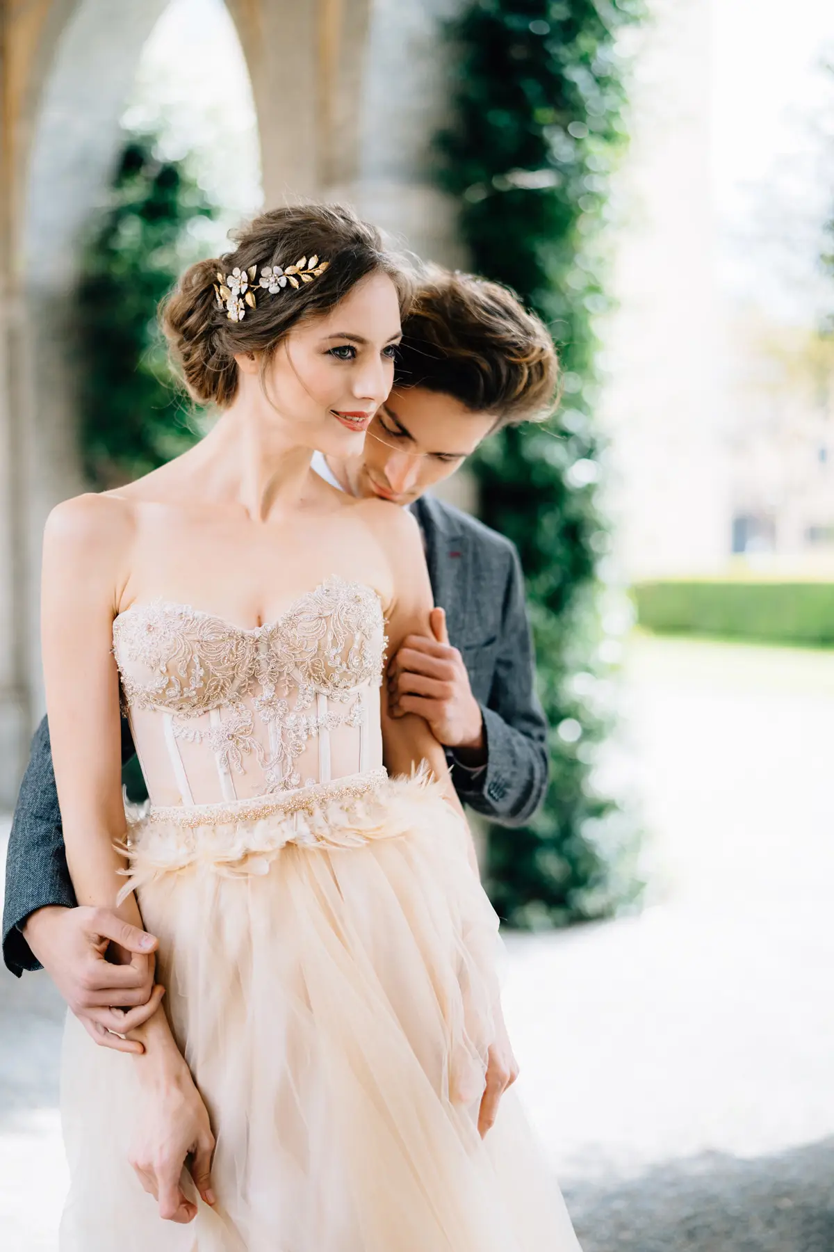 Styled wedding shoot with model couple under floral arch featured on modelcouples.network
